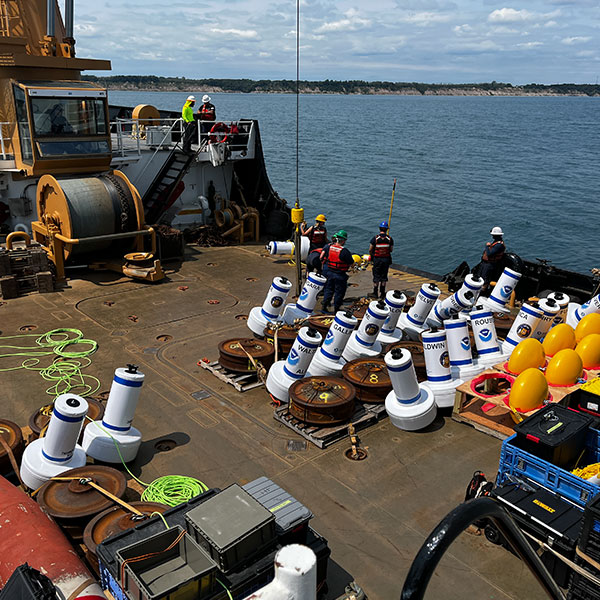 A collection of buoys on the deck of a large ship.