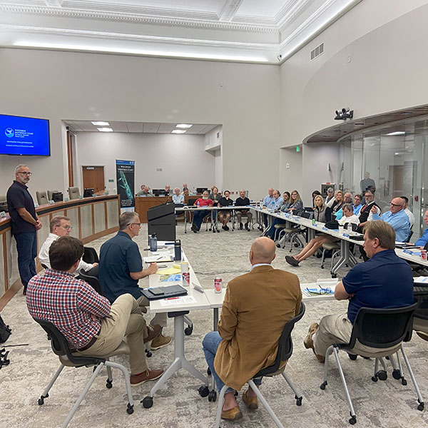 Large group of people in a conference room.