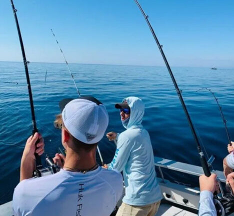 Group of people on a boat fishing.